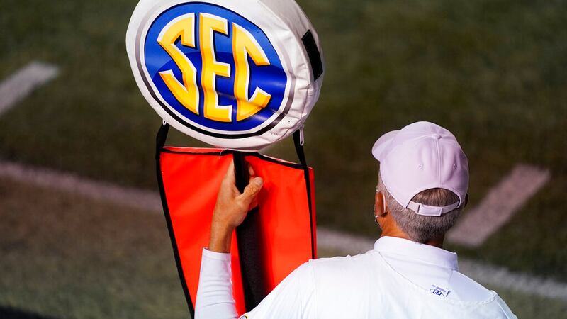 A member of the chain gang holds a marker with the SEC logo in the second half of an NCAA...
