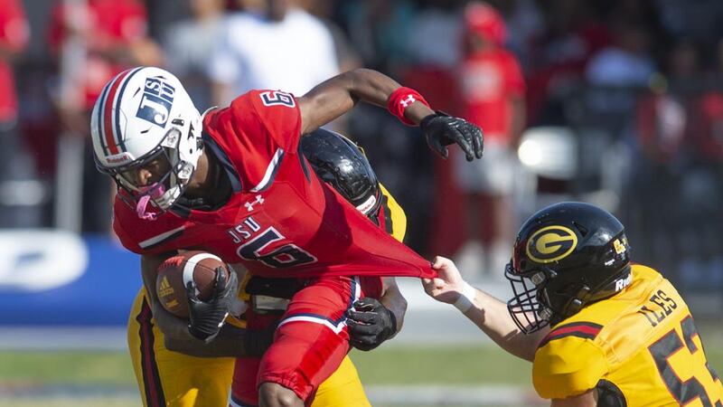 Jackson State safety John Huggings (6) pushes through Grambling State defense during the...