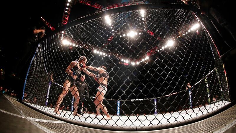 Felice Herrig, left, punches Karolina Kowalkiewicz during the third round of a women's...