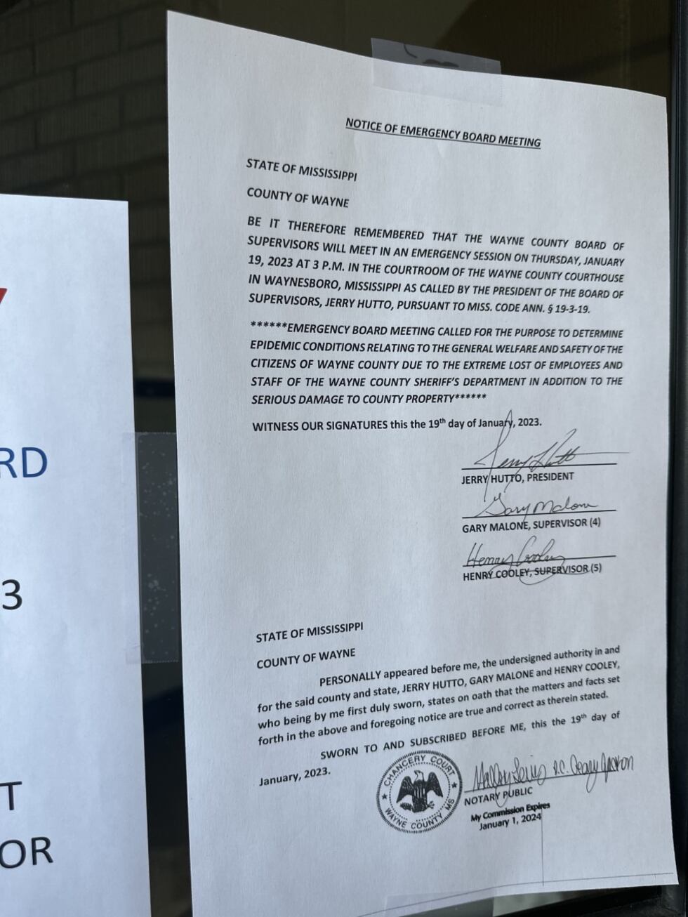 The notice of emergency board meeting was posted outside the courthouse.