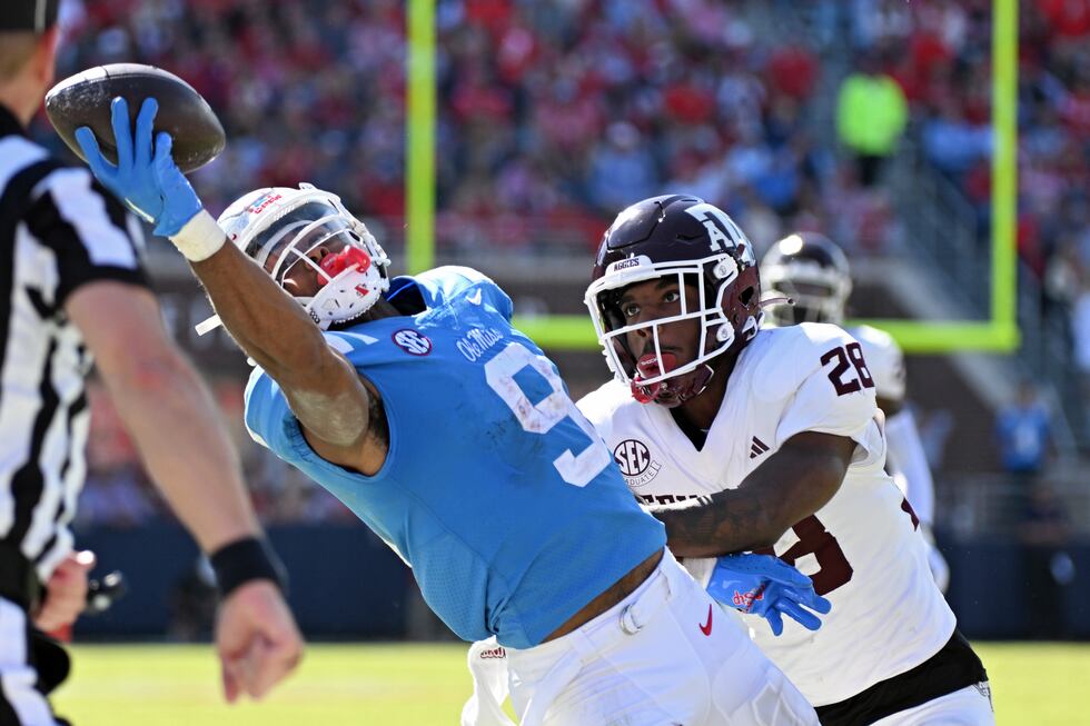 Mississippi wide receiver Tre Harris (9) catches a pass past Texas A&M defensive back Josh...