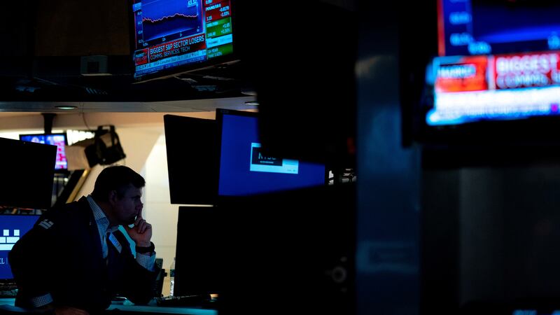 Traders work on the floor of the New York Stock Exchange on Tuesday, Sept. 13, 2022. (AP...