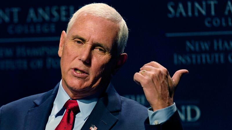 Former Vice President Mike Pence gestures during the "Politics and Eggs" breakfast gathering,...