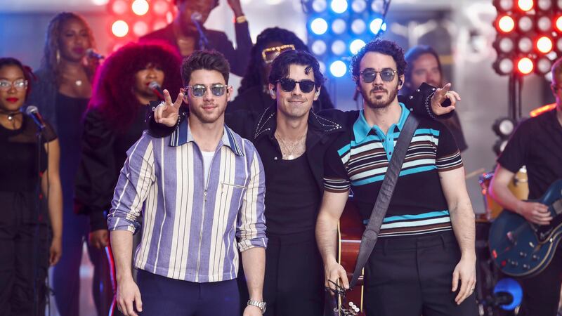 Nick Jonas, from left, Joe Jonas and Kevin Jonas of the Jonas Brothers perform on NBC's Today...