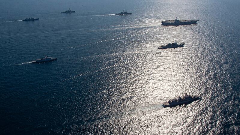 FILE - U.S. aircraft carrier USS Ronald Reagan, top right, participates with other U.S. and...